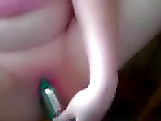 Green dildo pleases her cunt